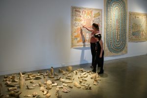 Tania Kirkland and her daughter Emily from Little Wings enjoying  > the exhibition at Lismore Regional Gallery